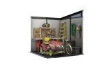 Abri installé avec tondeuse et rangement organisé