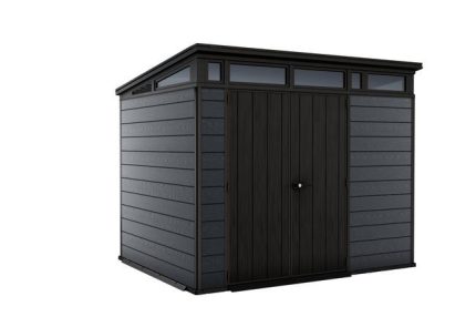 Vue en angle de l'abri gris anthracite installé dans un jardin