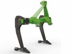 Vue latérale de la machine montée sur un attelage de tracteur en champ